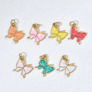 Set of colorful enamel butterfly pendants for DIY jewelry making on white background