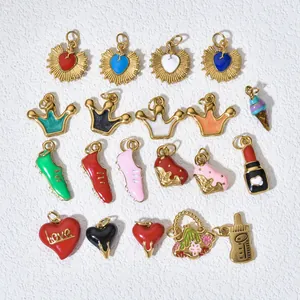 Close-up of various colorful stainless steel enamel DIY jewelry charms and heart pendants