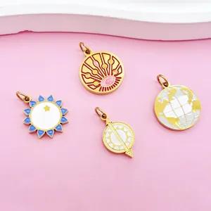 Detailed view of gold-plated stainless steel tarot sun, moon, and globe enamel charms