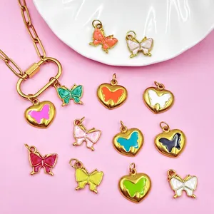 Macro detail of colorful enamel butterfly and heart charms for DIY jewelry making projects