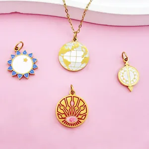 Detailed view of four gold stainless steel Tarot pendants featuring sun and globe designs