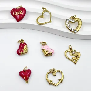 Close-up of assorted stainless steel heart charms with colorful enamel and rhinestones