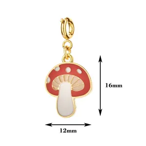 Detail shot of the red mushroom enamel pendant showing dimensions of 16mm by 12mm