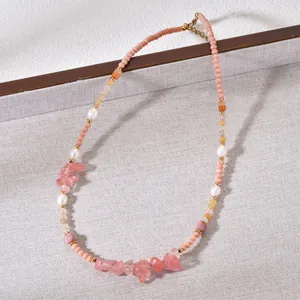 Detailed view of handmade beaded necklace featuring pink natural stones and white pearls