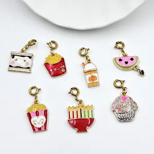 Detailed view of colorful enamel snack and festive charms with glitter for DIY jewelry.