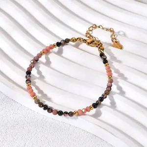Detailed close-up of the natural stone beaded bracelet with colorful gems and gold clasp.