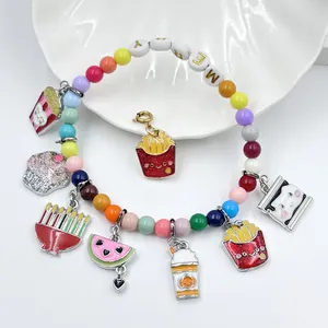 Detail view of colorful beaded bracelet with cute snack charms like fries and popcorn.