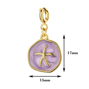 Macro view of 18K gold plated starfish charm with purple enamel detail, 17mm size