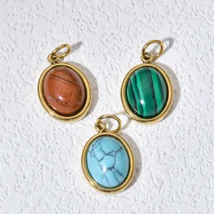 Detail showing three oval gemstone pendants in jasper, malachite, and turquoise colors.