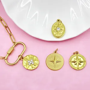 Detailed shot of gold stainless steel eight-pointed star charms on a paperclip chain
