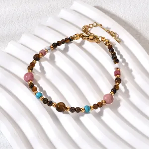 Close-up detail of a colorful natural stone beaded bracelet with a gold-plated adjustable clasp