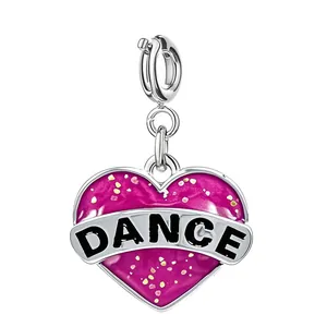 Heart-shaped silver alloy charm featuring DANCE text and sparkling magenta enamel inlay