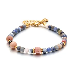 Elegant natural stone beaded bracelet with blue ink-wash and pink stones, gold clasp.