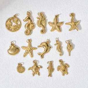 Collection of golden sea themed stainless steel charms including seahorse and starfish