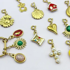Colección de dijes de acero inoxidable con corazón, sol y cruz de perlas para joyería DIY.