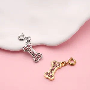 Knochenförmige Legierungsanhänger mit rosa Strasssteinen und Federverschlüssen für Schmuck