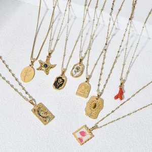 Detailed view of various 18K gold plated stainless steel necklaces with artistic pendants.