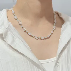 Detail shot of natural crystal stone dopamine beaded necklace on female neck