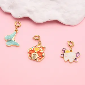 Group of cute cartoon alloy charms featuring butterfly, house, and smiling tooth shapes