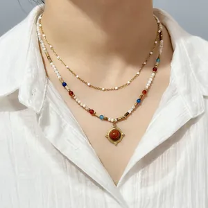 Bohemian layered beaded necklace with colorful stones and a sunburst pendant detail