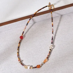 Detailed view of colorful natural stone beads on a premium beaded clavicle necklace