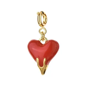 Retro style red enamel heart pendant in stainless steel with elegant gold accents.