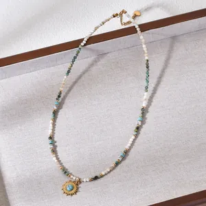 Detailed view of a Bohemian beaded necklace featuring a gold sun pendant with turquoise