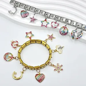 Detail of modular DIY charm bracelet with colorful rhinestone heart and star charms