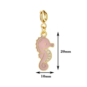 Detailed macro shot of a pink enamel seahorse charm showing 20mm by 10mm dimensions