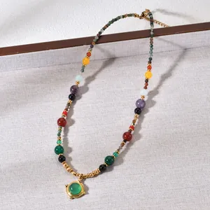 Close-up of vintage ethnic style necklace with colorful agate and tiger eye beads