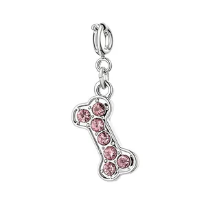 Silberner Knochen-Anhänger mit funkelnden rosa Kristallen für DIY-Schmuckdesign.