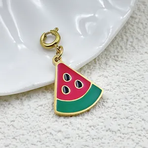 Watermelon slice pendant in 18K gold-plated stainless steel with red and green enamel.