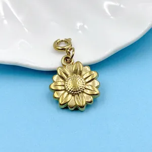 Close-up of golden sunflower pendant with detailed texture and spring ring clasp