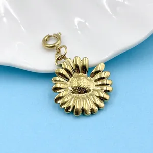 Close-up of a detailed 18K gold plated daisy flower pendant for DIY jewelry making