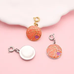 Close-up of orange glitter basketball charms with purple heart for DIY jewelry making