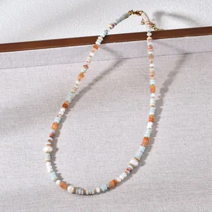 Close-up detail of handmade natural stone and freshwater pearl beaded choker necklace