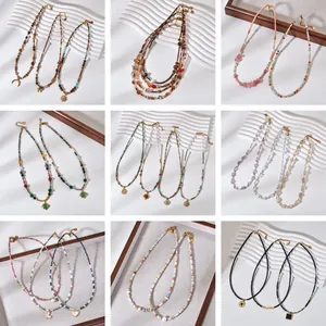 Bohemian natural stone beaded necklaces with sun pendants in various vibrant colors.