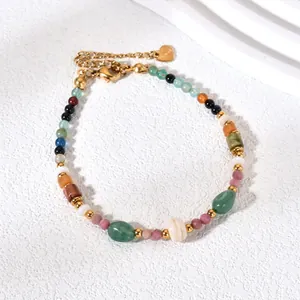 Macro detail of colorful natural stone beaded bracelet with golden stainless steel accents