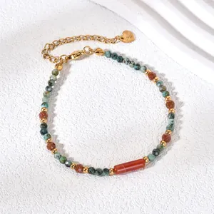 Detail of a retro Chinese style colorful natural stone beaded bracelet with gold accents.