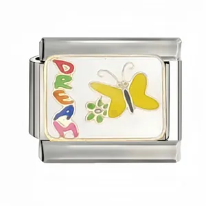 Macro detail of an Italian charm link with a yellow butterfly and colorful DREAM text.