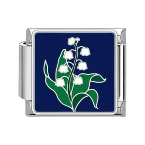 Detail of stainless steel Italian charm link with Lily of the Valley enamel design
