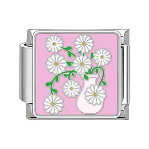 Stainless steel Italian charm link with white daisy flowers on pink background