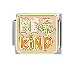 Detailed view of a stainless steel Italian charm link featuring a colorful BE KIND design