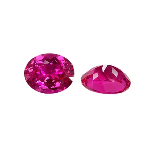 Saphir rose vif de synthèse taille ovale, pierre précieuse pour création de bijoux.