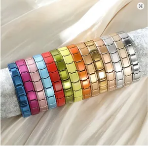 Detailed view of colorful stainless steel Italian modular bracelets in various finishes