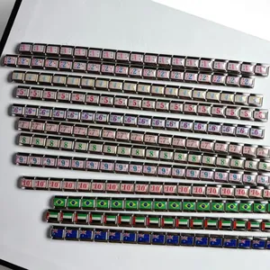 Detail view of UV-printed stainless steel Italian charm links with numbers and flags