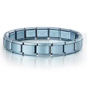 Macro view of matte blue Italian modular bracelet showing stainless steel engraving