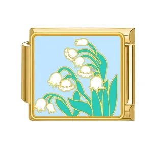 Gold Italian modular bracelet charm featuring a light blue lily of the valley enamel design.