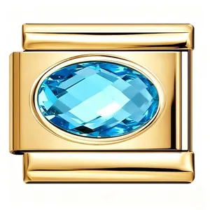 Close-up macro view of a gold stainless steel Italian charm link with blue oval zircon