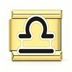 Close-up of gold stainless steel Italian charm with black Libra zodiac symbol